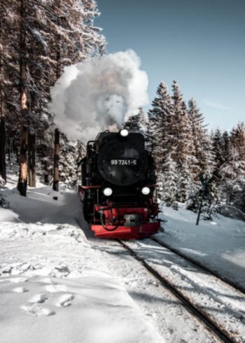 Front view of a steam train in the snow birthday card