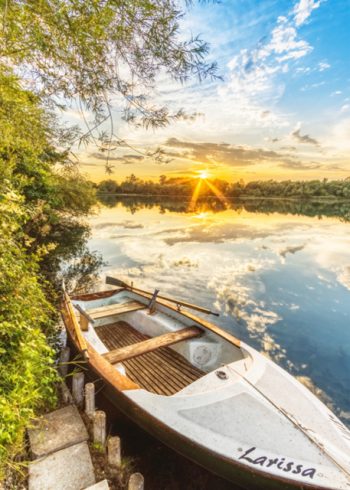Rowing boat moored on lake edge birthday card